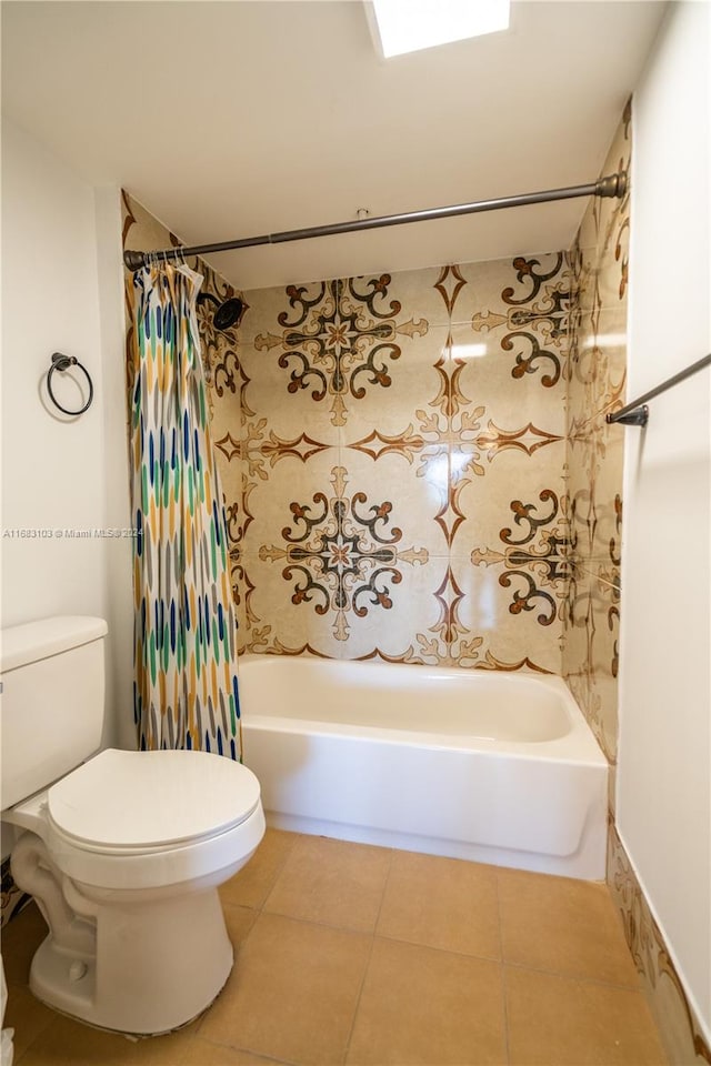 bathroom with shower / bath combination with curtain, toilet, and tile patterned flooring