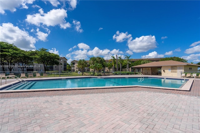 view of swimming pool with a patio