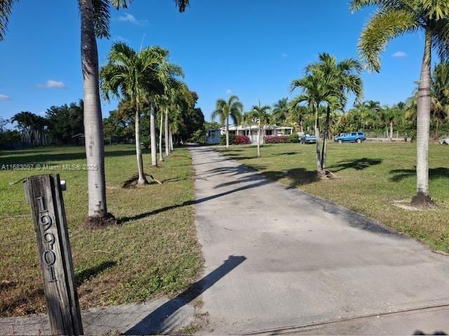 view of property's community with a lawn