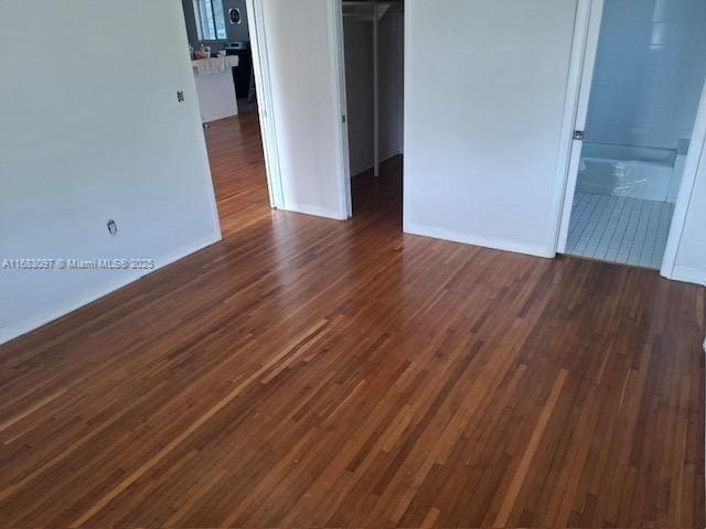 unfurnished room featuring dark hardwood / wood-style flooring