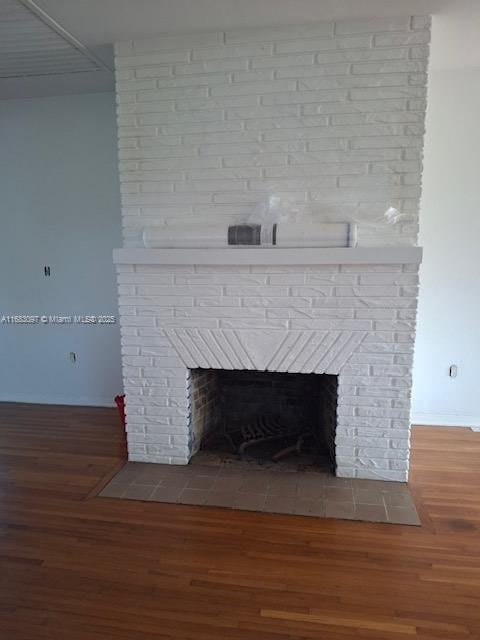 room details with a fireplace and hardwood / wood-style floors