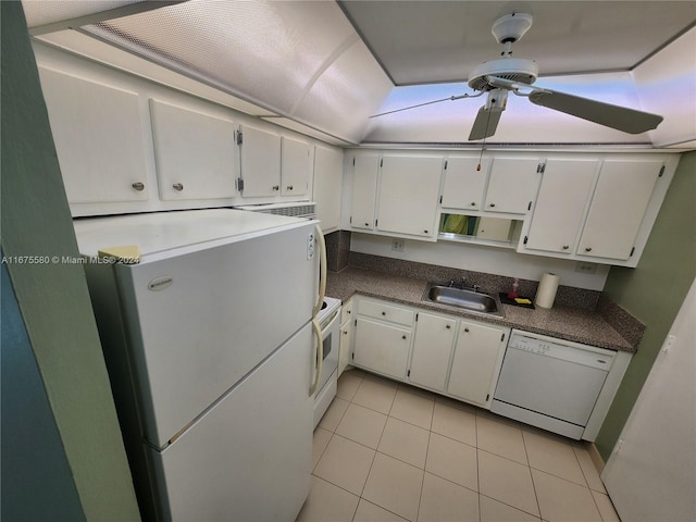 kitchen featuring white appliances, light tile patterned floors, white cabinetry, and sink