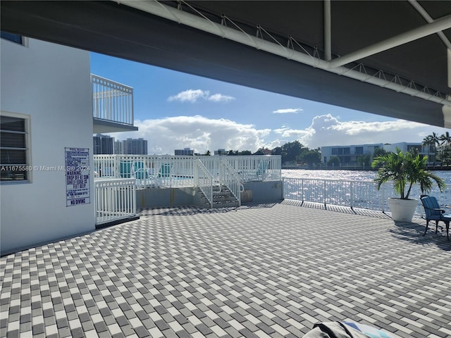 view of patio with a water view