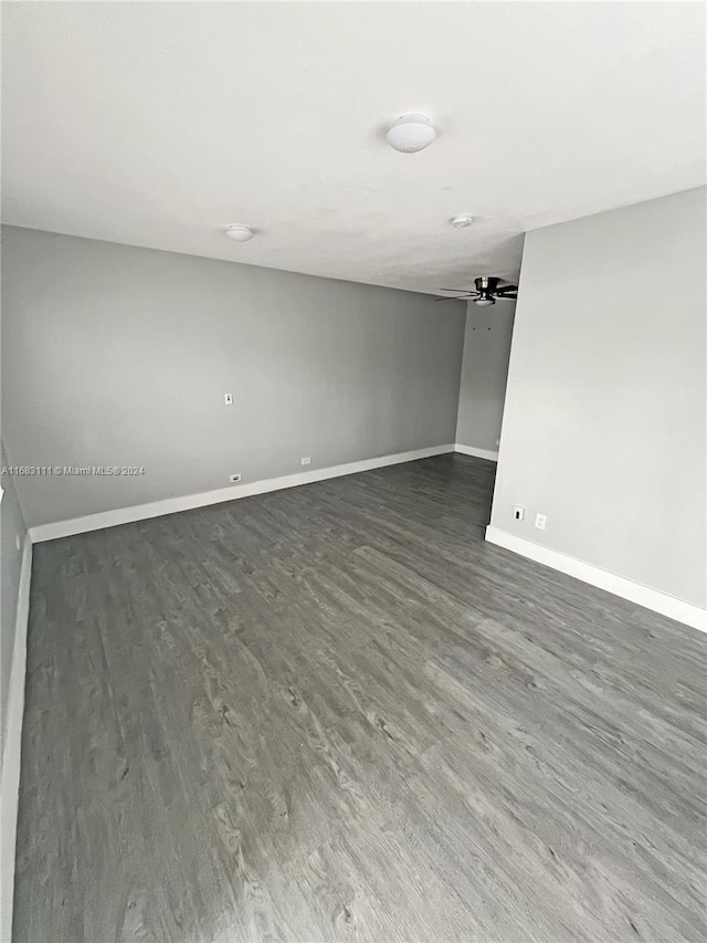 spare room with dark hardwood / wood-style flooring