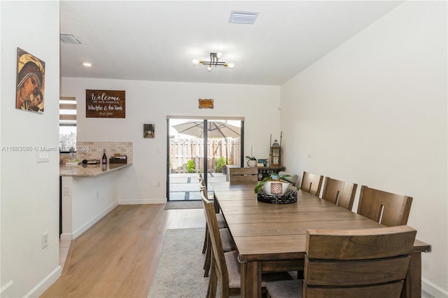 dining space featuring light hardwood / wood-style flooring