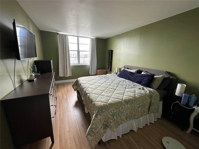 bedroom featuring hardwood / wood-style floors