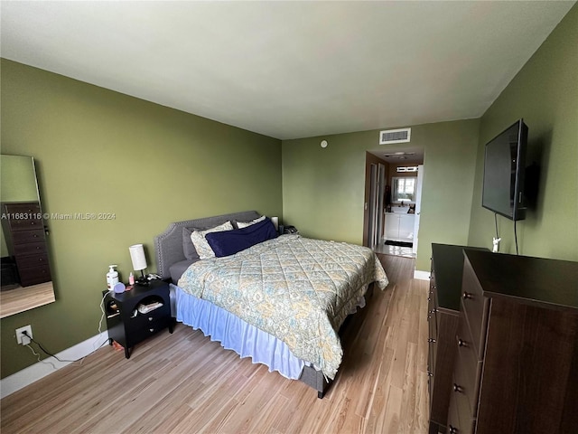 bedroom featuring light wood-type flooring