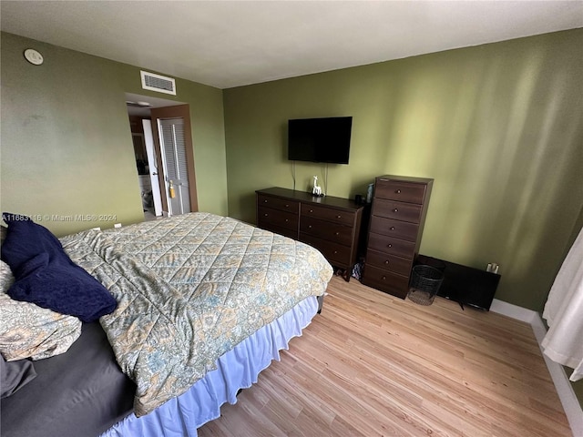 bedroom with light hardwood / wood-style floors