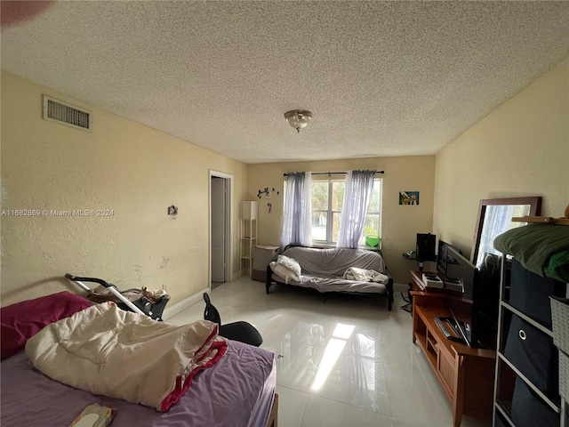 bedroom featuring a textured ceiling