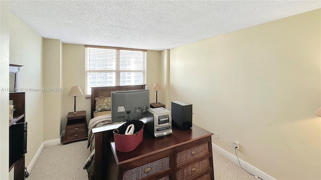 office space with a textured ceiling