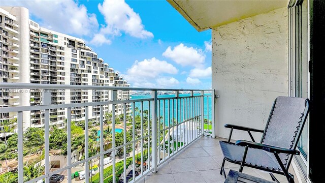 balcony featuring a water view