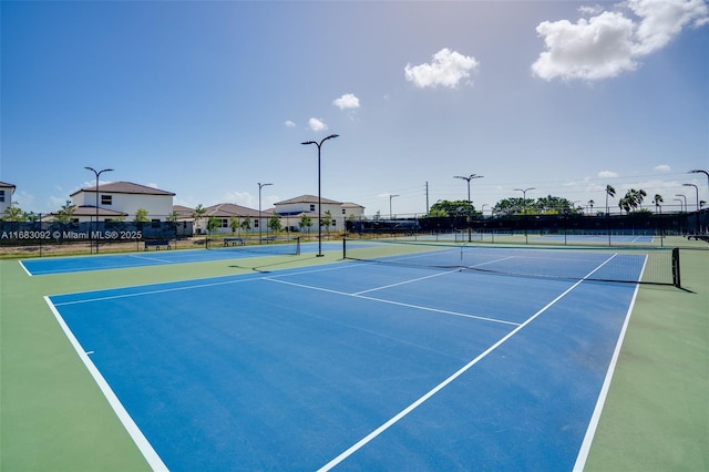 view of sport court with basketball hoop