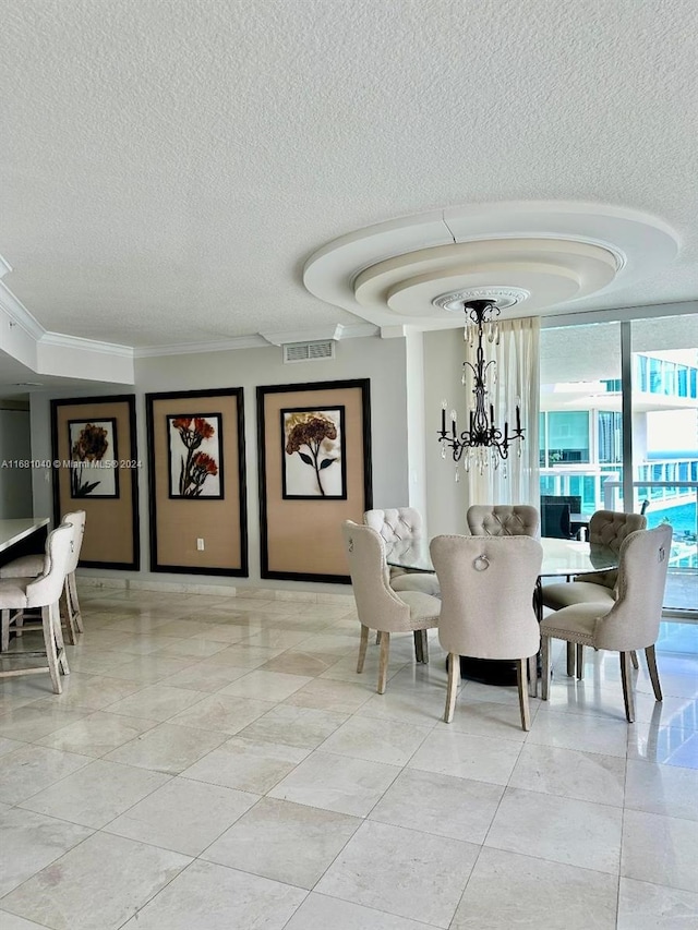 dining space with crown molding, a textured ceiling, and a chandelier