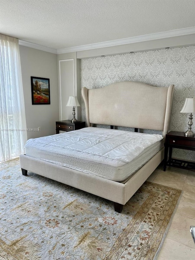 bedroom featuring a textured ceiling, ornamental molding, and tile patterned flooring