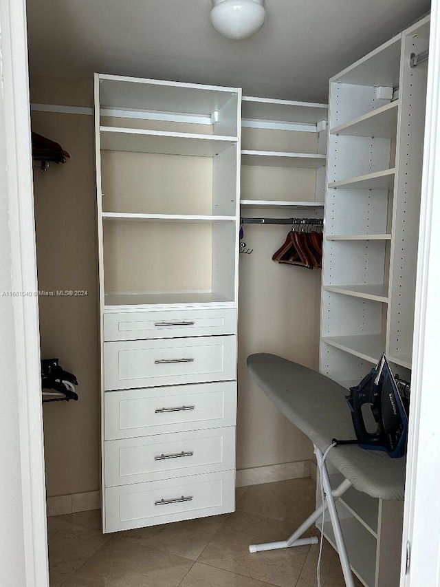 spacious closet featuring tile patterned floors