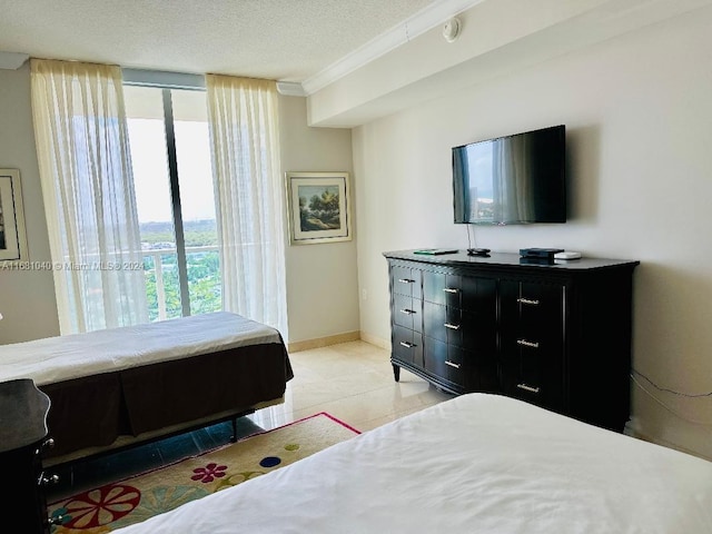 bedroom with crown molding and a textured ceiling