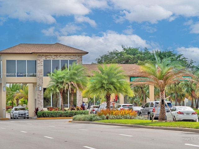 12800 SW 7th Ct Unit 313G, Pembroke Pines, FL 33027 - view of building exterior with uncovered parking