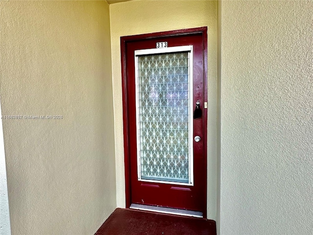 12800 SW 7th Ct Unit 313G, Pembroke Pines, FL 33027 - doorway to property featuring stucco siding