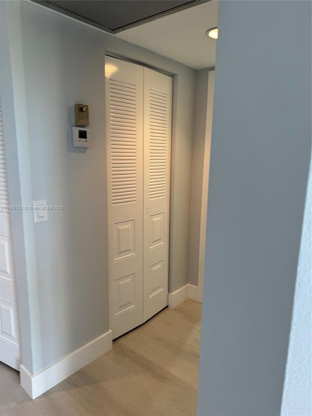 corridor featuring light hardwood / wood-style floors