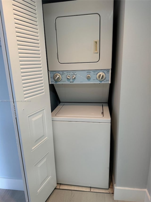 12800 SW 7th Ct Unit 313G, Pembroke Pines, FL 33027 - laundry room with stacked washer / drying machine and baseboards