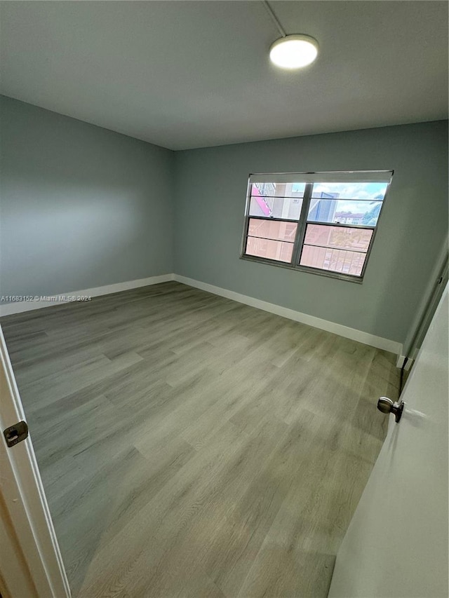 spare room featuring light wood-type flooring