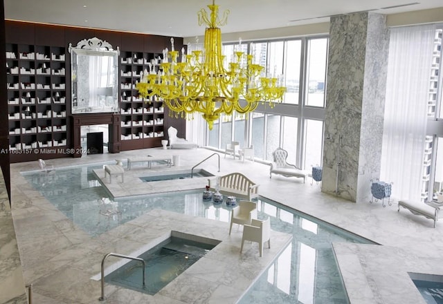 view of pool with an inviting chandelier