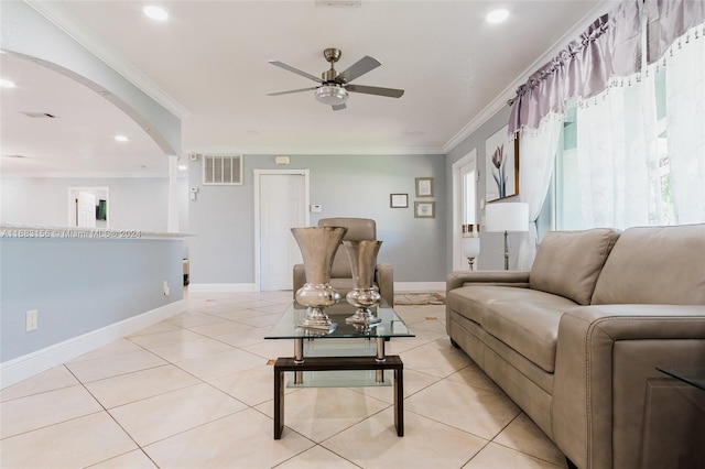 tiled living room featuring crown molding and ceiling fan