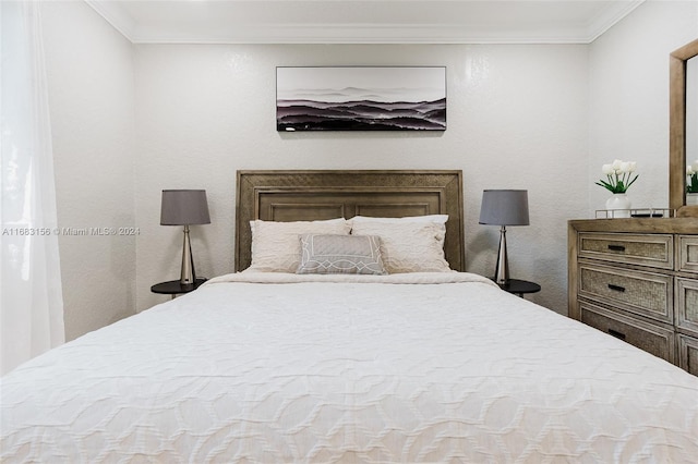 bedroom featuring crown molding