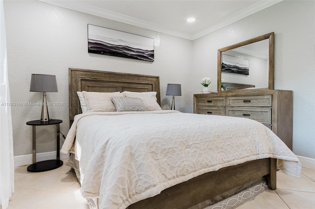 bedroom featuring crown molding and light tile patterned floors