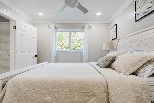 bedroom with ornamental molding and ceiling fan