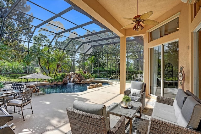 view of patio with a lanai and ceiling fan