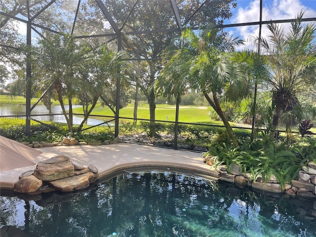 view of pool with a patio and a lanai