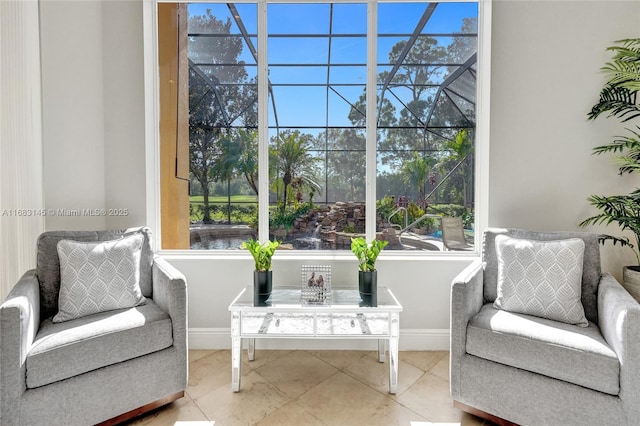 sitting room featuring tile patterned flooring and a healthy amount of sunlight