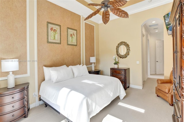 bedroom featuring ornamental molding, light colored carpet, and ceiling fan