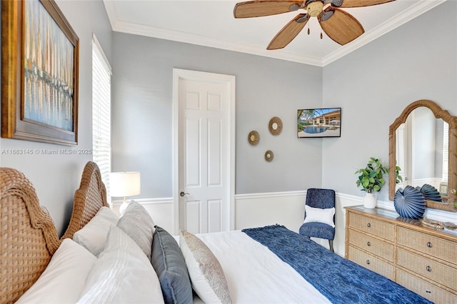 bedroom featuring ornamental molding and ceiling fan