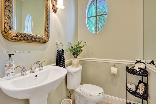 bathroom with sink and toilet