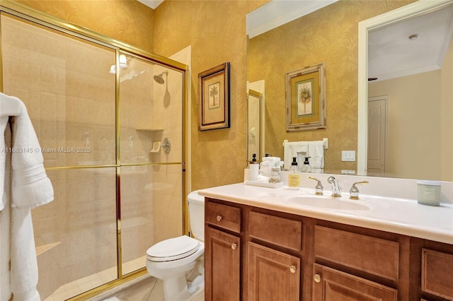 bathroom with toilet, an enclosed shower, crown molding, vanity, and tile patterned flooring