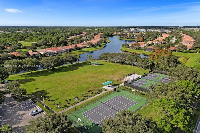 birds eye view of property with a water view