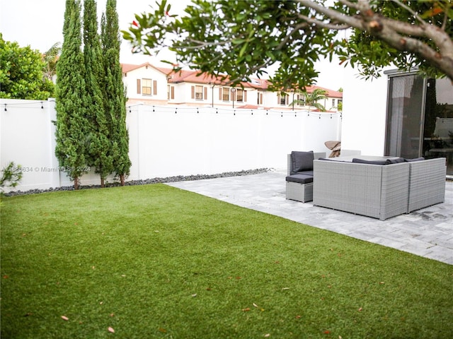 view of yard featuring a patio area and outdoor lounge area