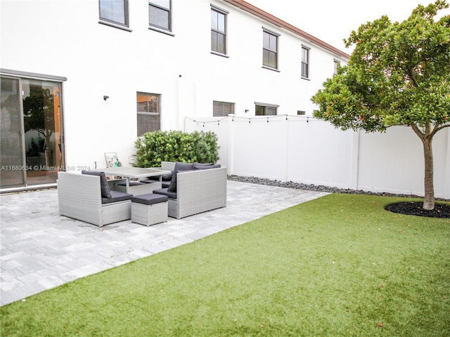 view of yard with a patio area and an outdoor living space