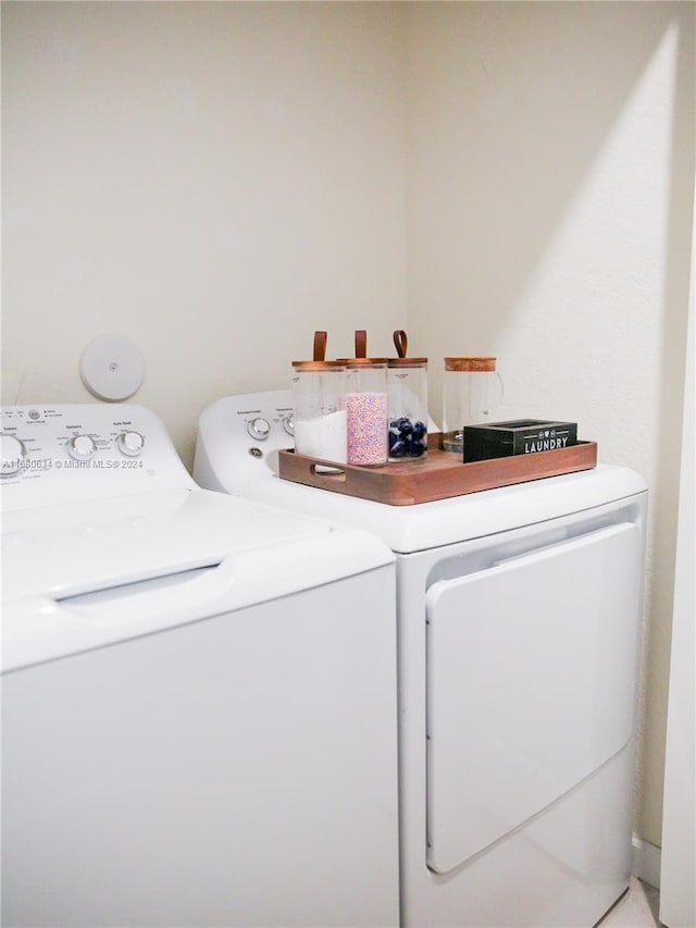 laundry room with washer and clothes dryer