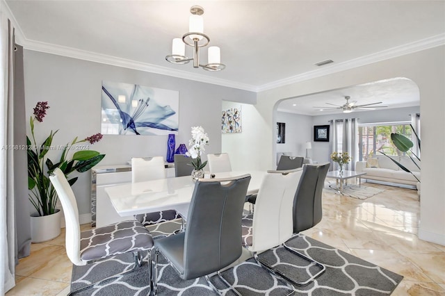 dining room featuring crown molding and ceiling fan with notable chandelier