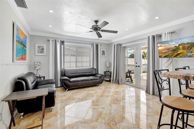 living room featuring crown molding, a textured ceiling, french doors, and ceiling fan