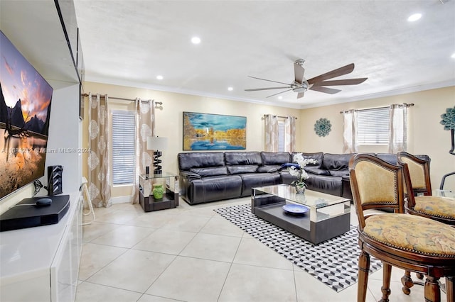 living room with crown molding, light tile patterned floors, and ceiling fan