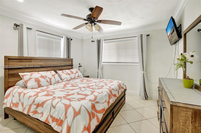 tiled bedroom featuring ceiling fan and ornamental molding