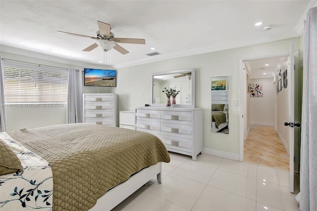 tiled bedroom featuring crown molding and ceiling fan