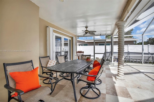 sunroom featuring ceiling fan