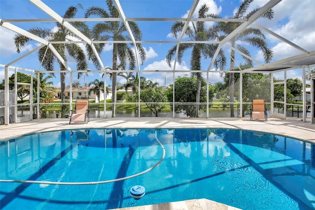 view of pool featuring a patio and glass enclosure