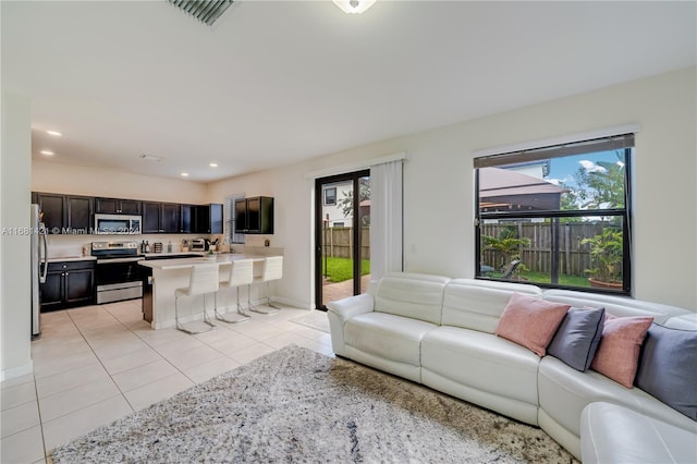 living room with light tile patterned floors