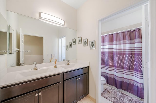 bathroom featuring vanity, toilet, tile patterned floors, and curtained shower